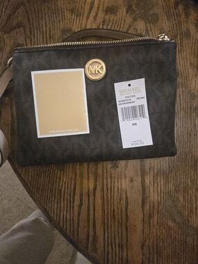 Michael Kors Brown Monogram Wristlet with Gold MK Emblem